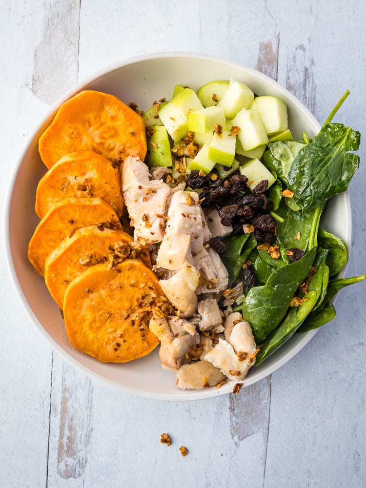 Harvest Bowl from above - sweet potatoes, diced chicken, raisins, spinach, and green apples
