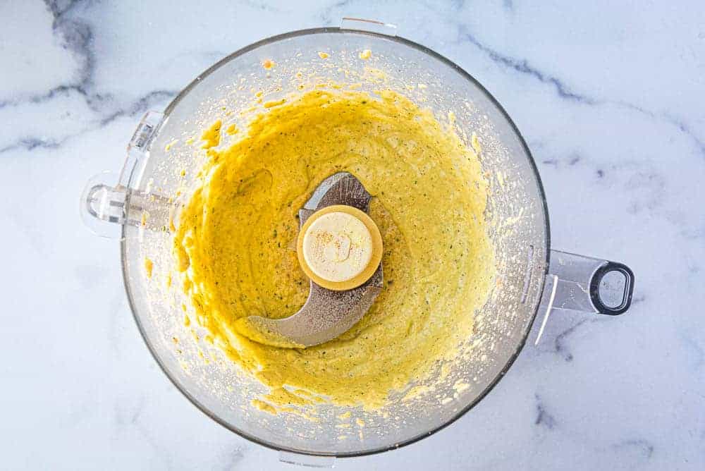 the mango dressing in a bowl of a food processor