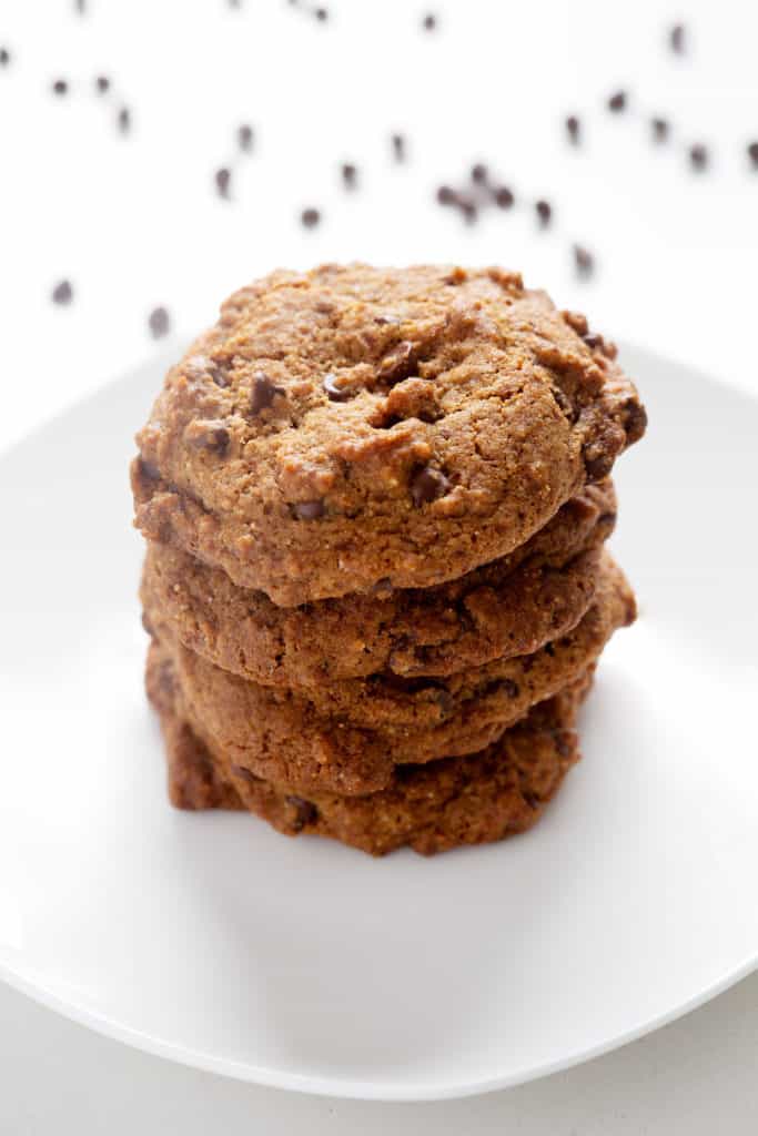 4 AIP Chocolate Chip Cookies stacked on top of each other on a white plate