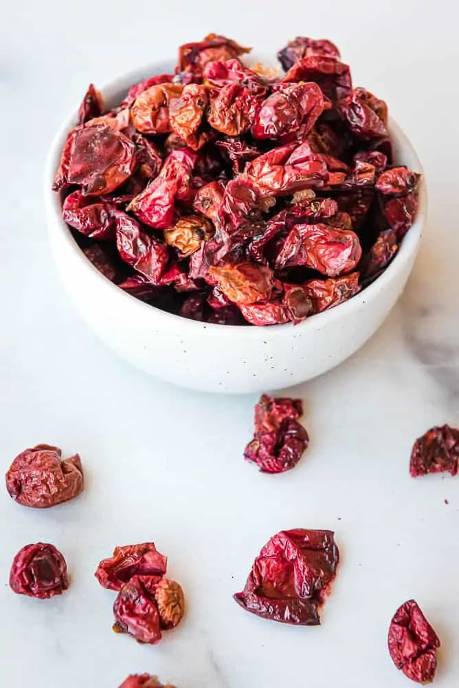dried cranberries piled high in a small white bowl